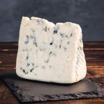 Wedge of Crater Lake Blue on stone cutting board