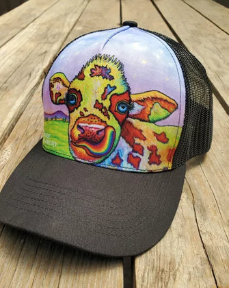 Alternative view of Rainbow Cow hat on wooden background